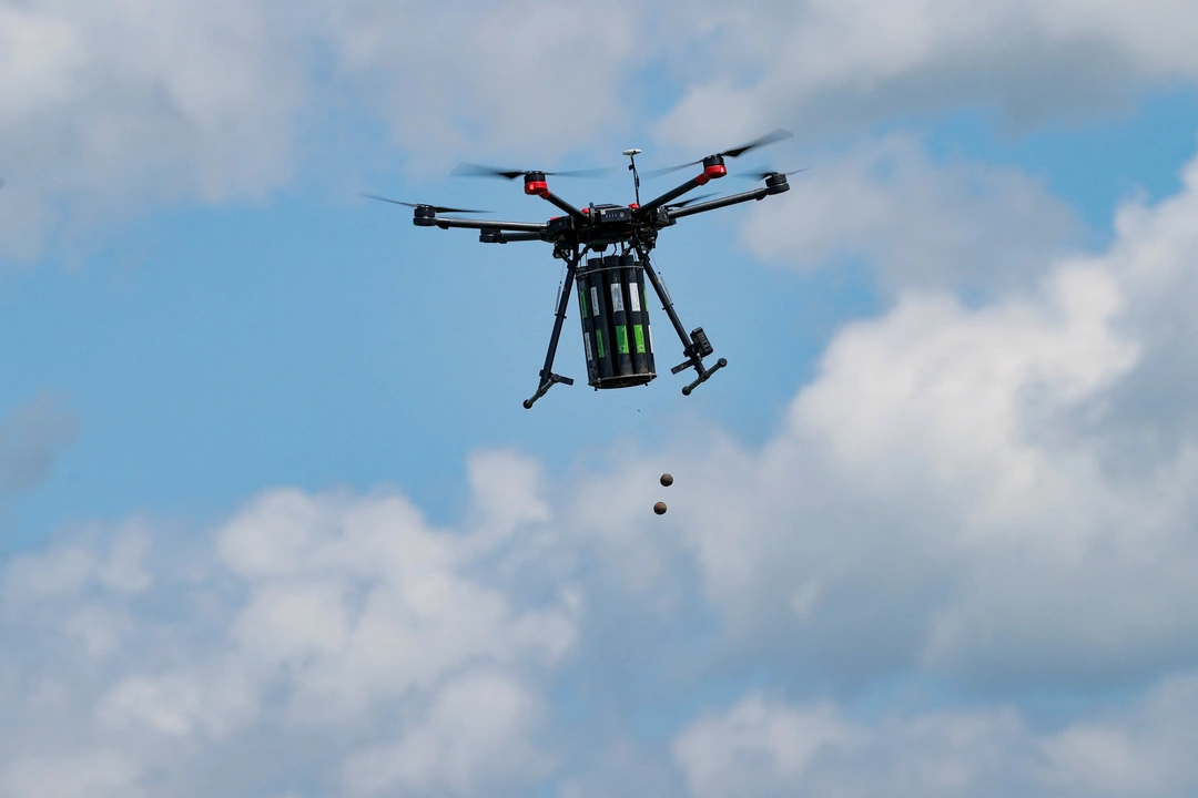 A drone drops seeds over a forested area on the first day of drone reforestation in Butovc, Kosovo May 13, 2024. REUTERS/Valdrin Xhemaj